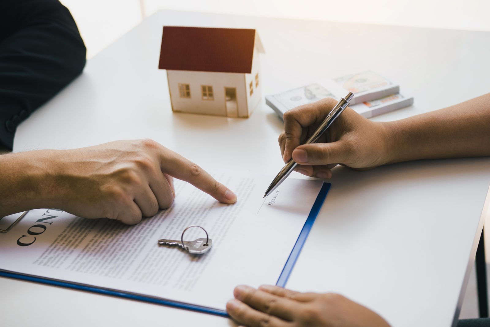 Signing a UAE mortgage document